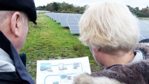 West Solent Director Cathy Cook explains the operation of the solar farm to Keith Taylor MEP